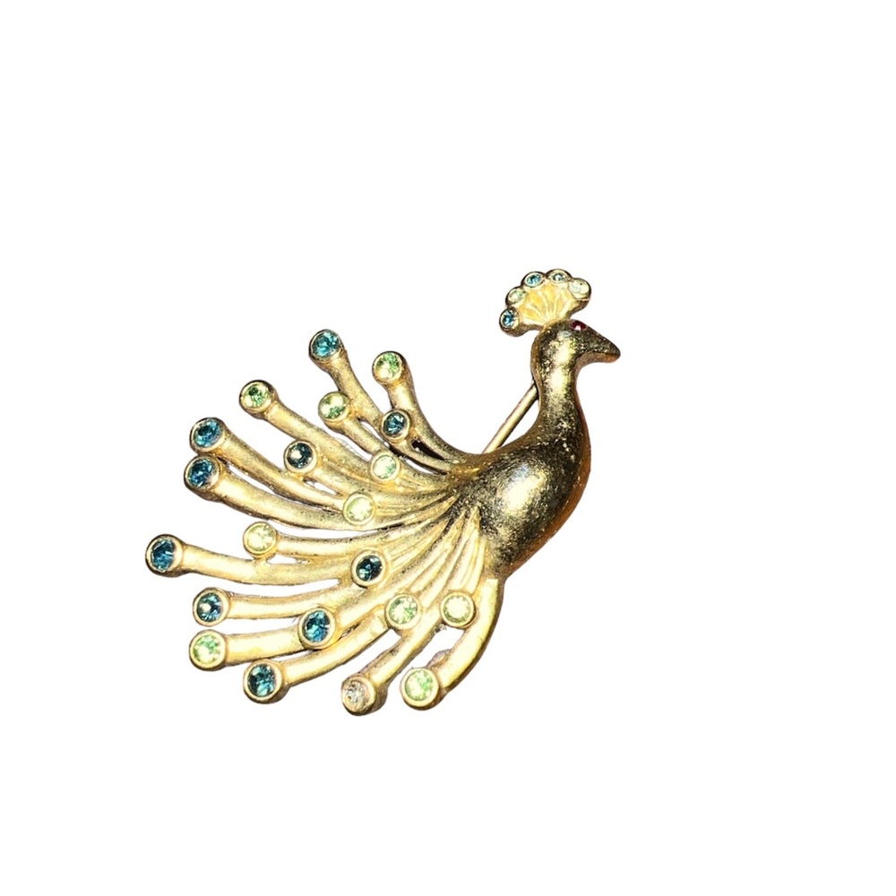 Vintage gold tone with multi colored stones peacock brooch.